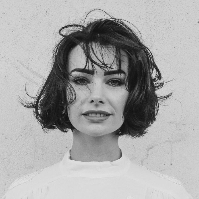 Black and white headshot of Krystal Prince, the owner of The Glamour Room in Essex. She has a dark brown bob, defined eyebrows and a slight smile. 