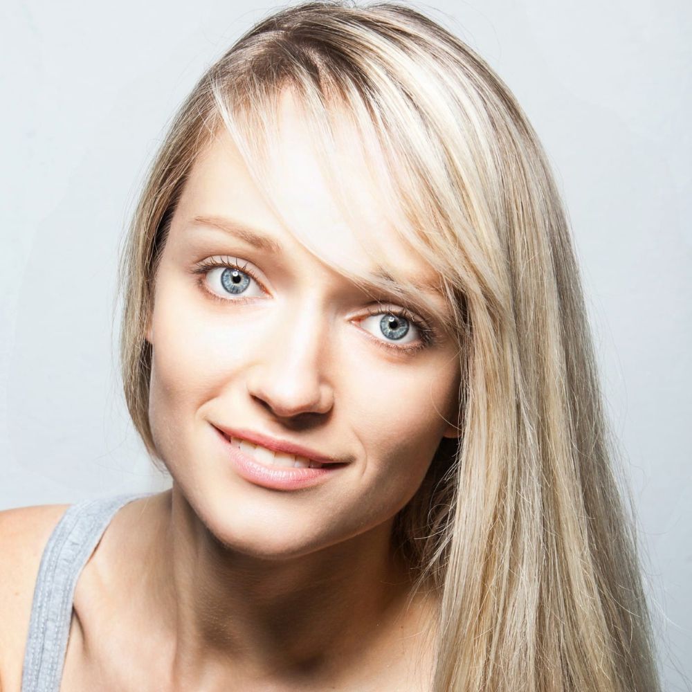 headshot of Alexandra Fraser, smiling to the camera