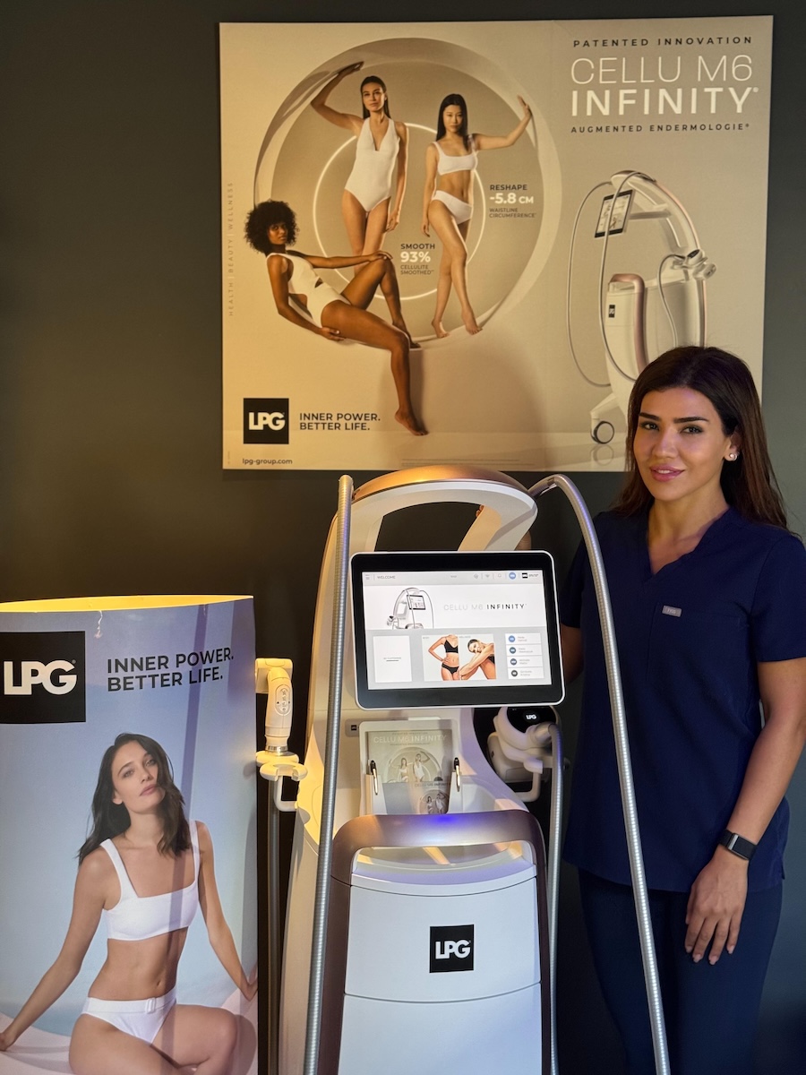 Salon owner Neda Hamidi standing with her LPG Cellu M6 Infinity device