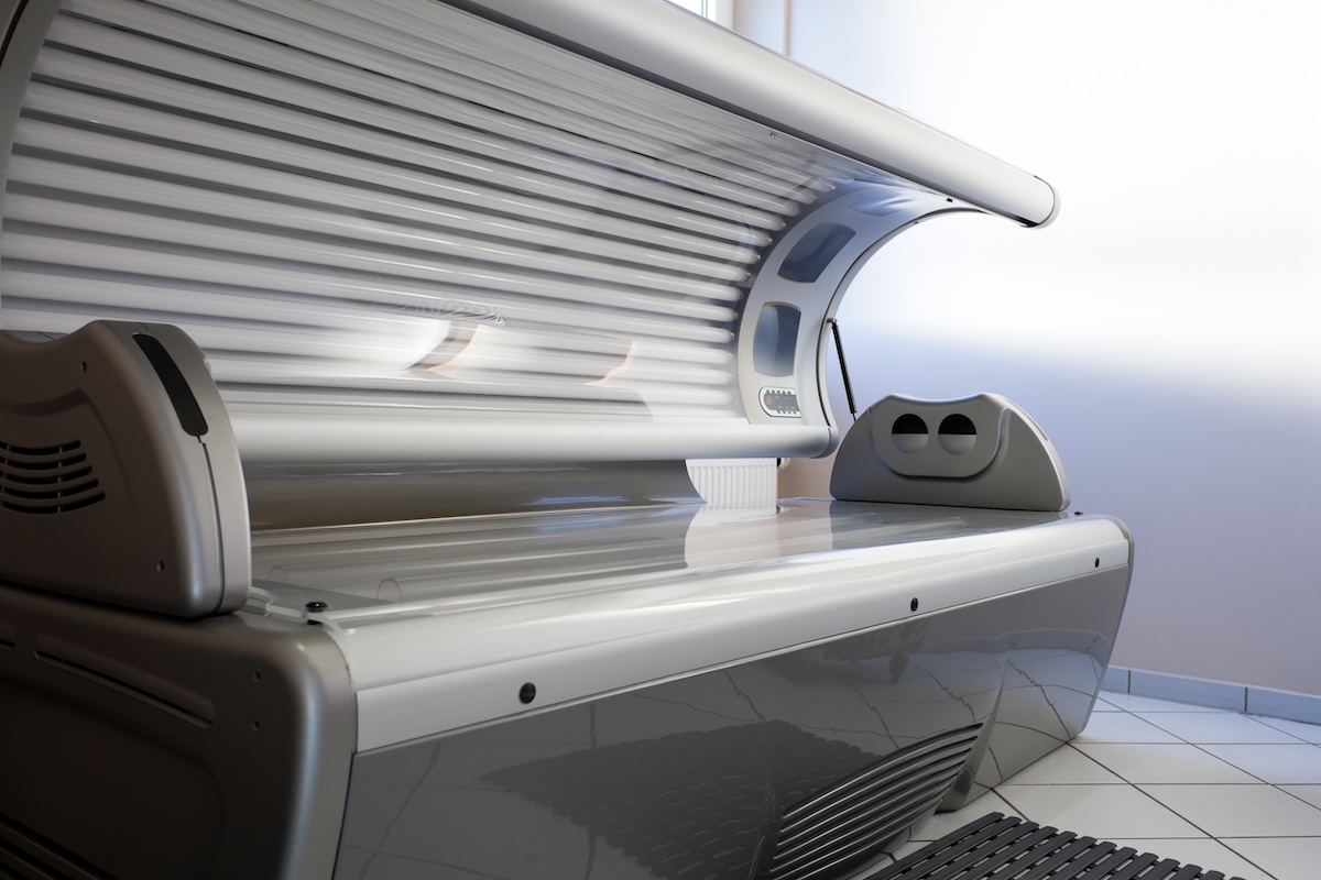 Open empty tanning bed in a salon