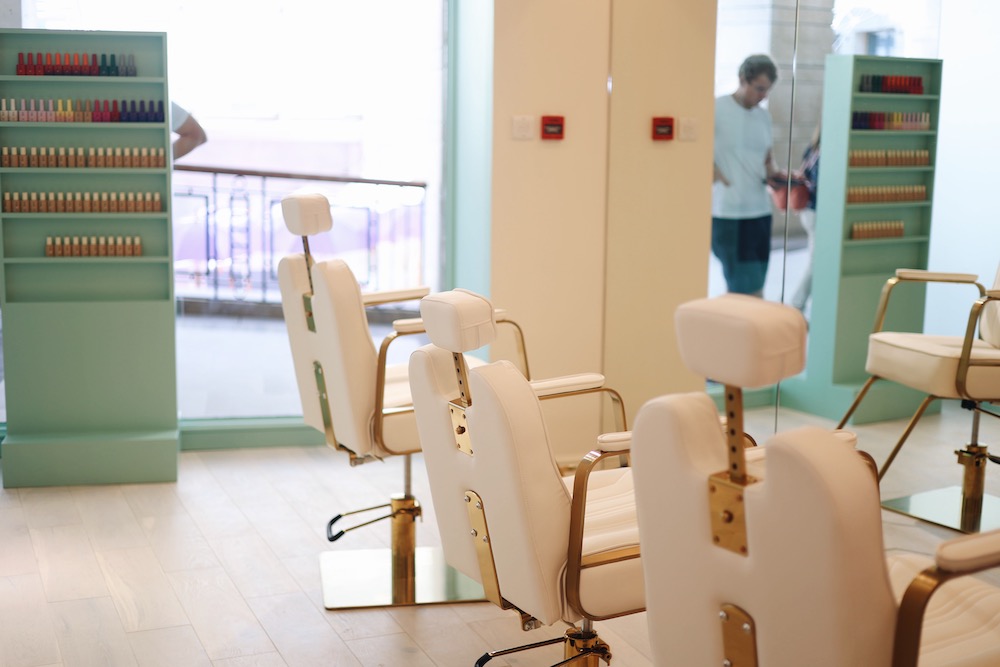 So.Shell nail and brow bar in Wimbledon, with cream salon chairs lined up