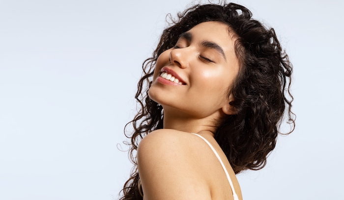 Woman with glowing, hydrated skin