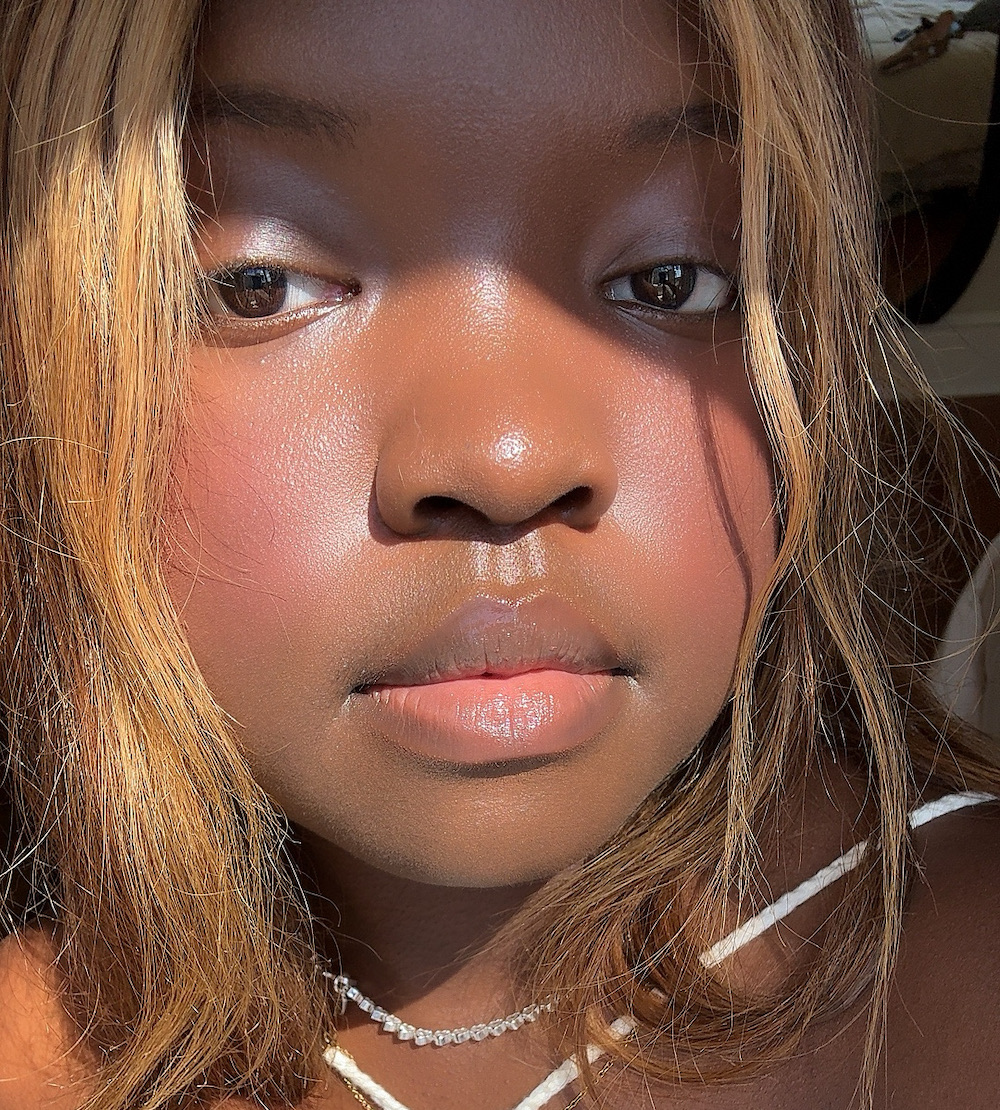 Black woman with blurry skin and soft finish blush