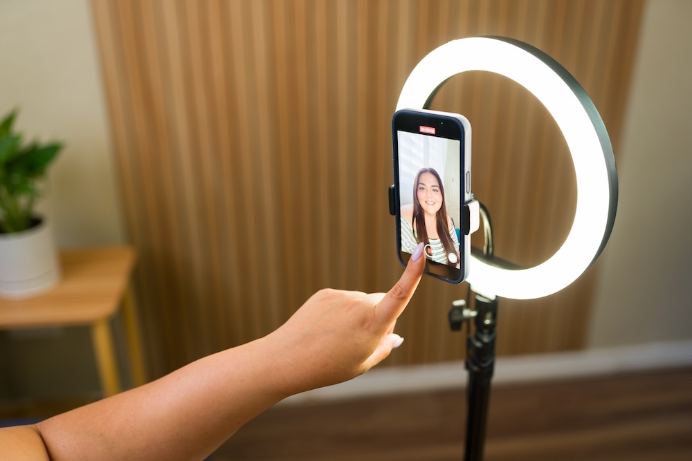 Beauty professional filming themselves to create personal branding content