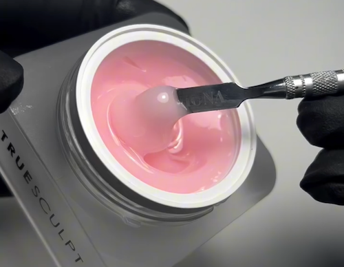 Lifestyle image showcasing HONA TrueSculpt gel nail system in use, part of the professional hypoallergenic range available at Ellisons