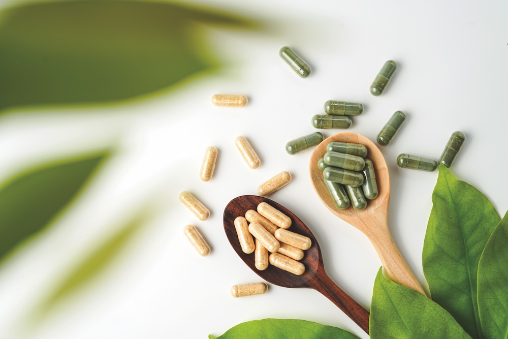 A pile of nutrition supplements representing key beauty and wellness trends