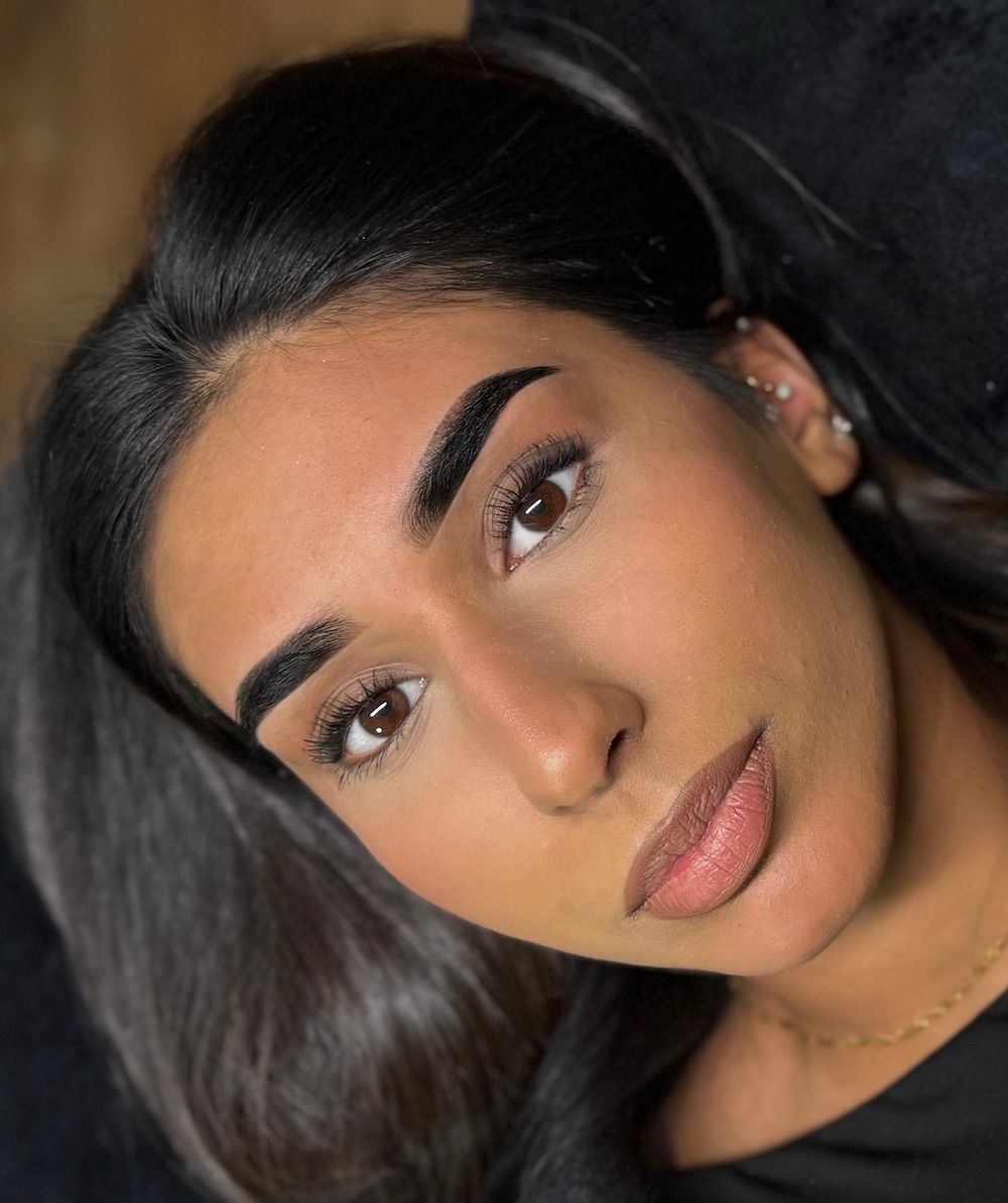 Close up of woman with sculpted black eyebrows