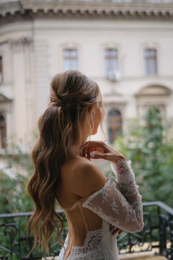 Brunette half-updo in bridal style with hair extensions