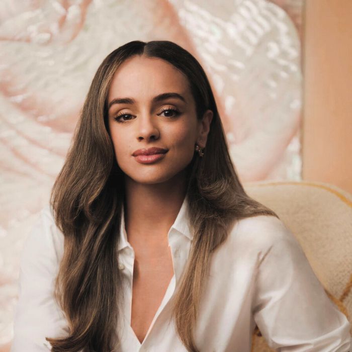 Headshot of Hadda Akrim against a pink-white background