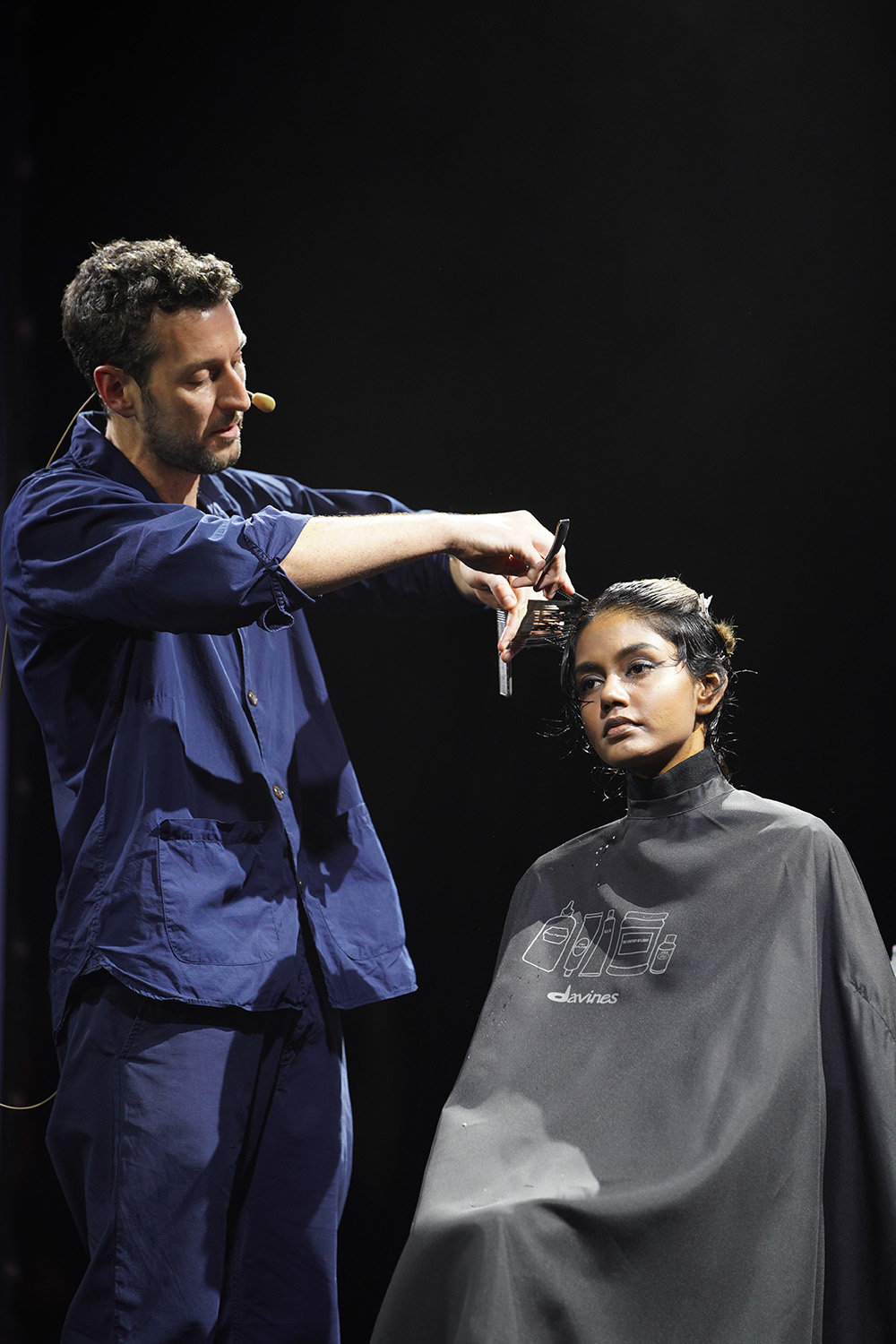 Tom Connell working on hair 