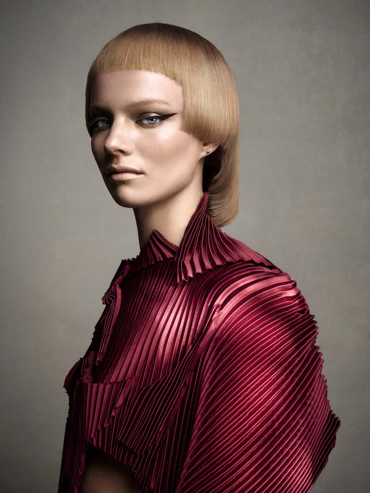 Golden blonde mid length hime cut with short curved micro fringe, styled straight from Efi Davies' British Hairdresser of the Year 2025 nominee collection at the British Hairdressing Awards, sponsored by Schwarzkopf Professional.