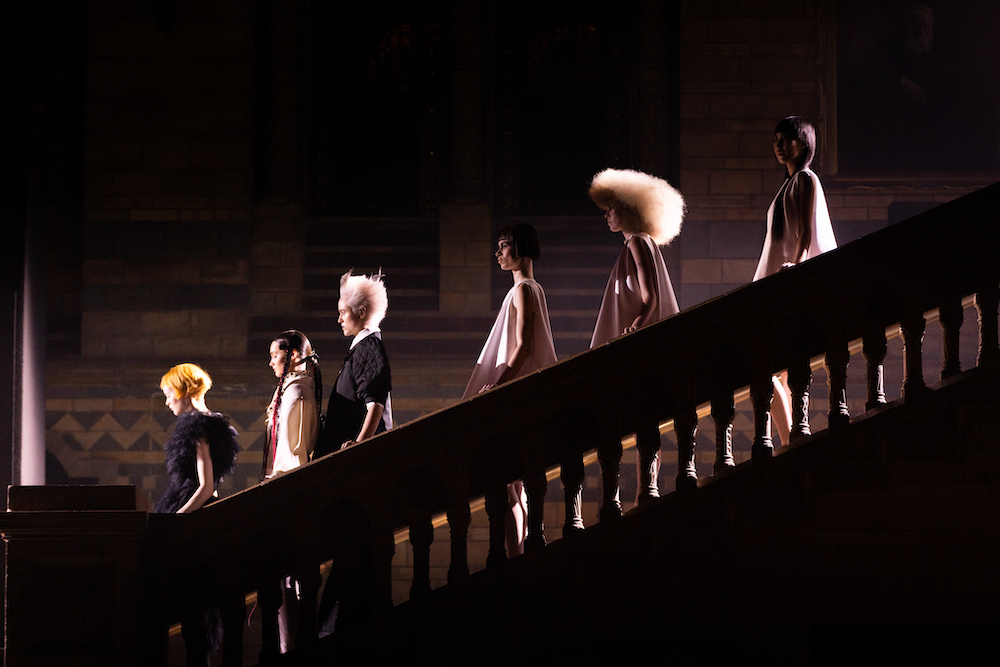 Models descending a set of stairs at a Wella Professionals TrendVision final