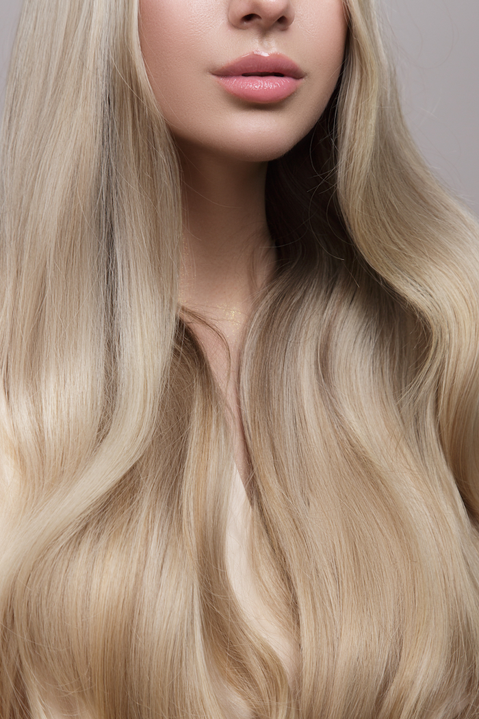 Long blonde hair with a soft wave, coloured using XP from Salon Services
