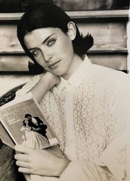 Black and white image of model with dark, flicked bob