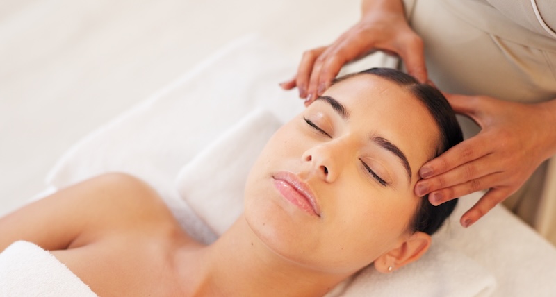 Client resting during a calming spa treatment designed to support maternal wellbeing