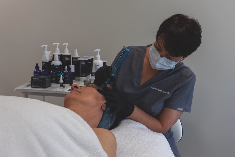 Candice Gardner, education manager at Dermalogica UK, performing a professional microneedling treatment on a client