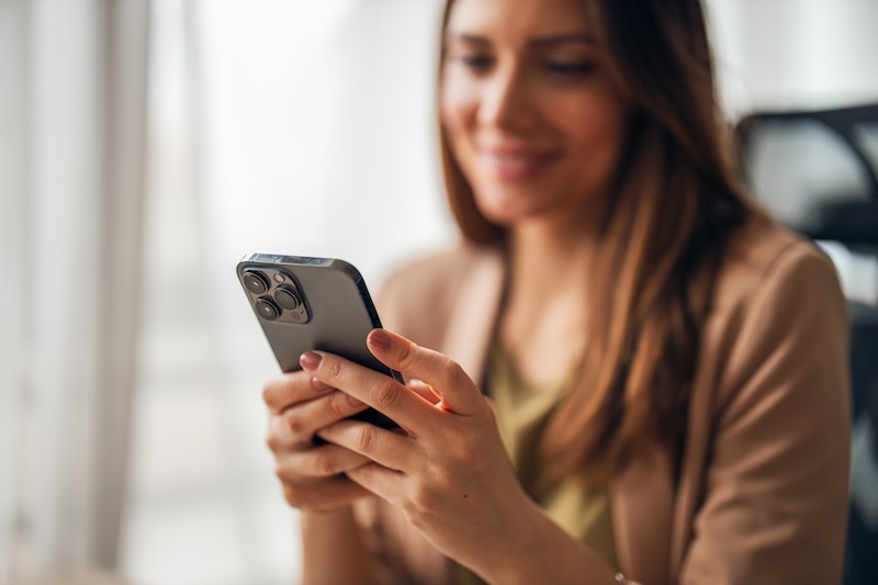 Woman looking at social media on her phone