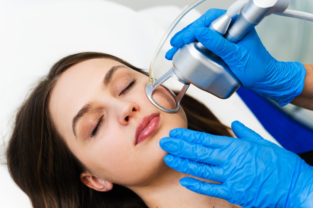 Laser skin resurfacing treatment on a patient in an aesthetic clinic.