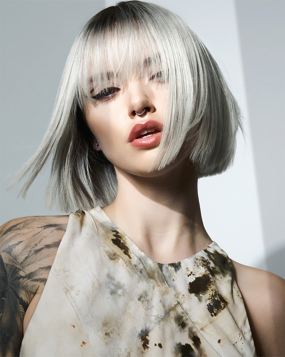 Sleek silver bob with root smudge from Daniel Spiller